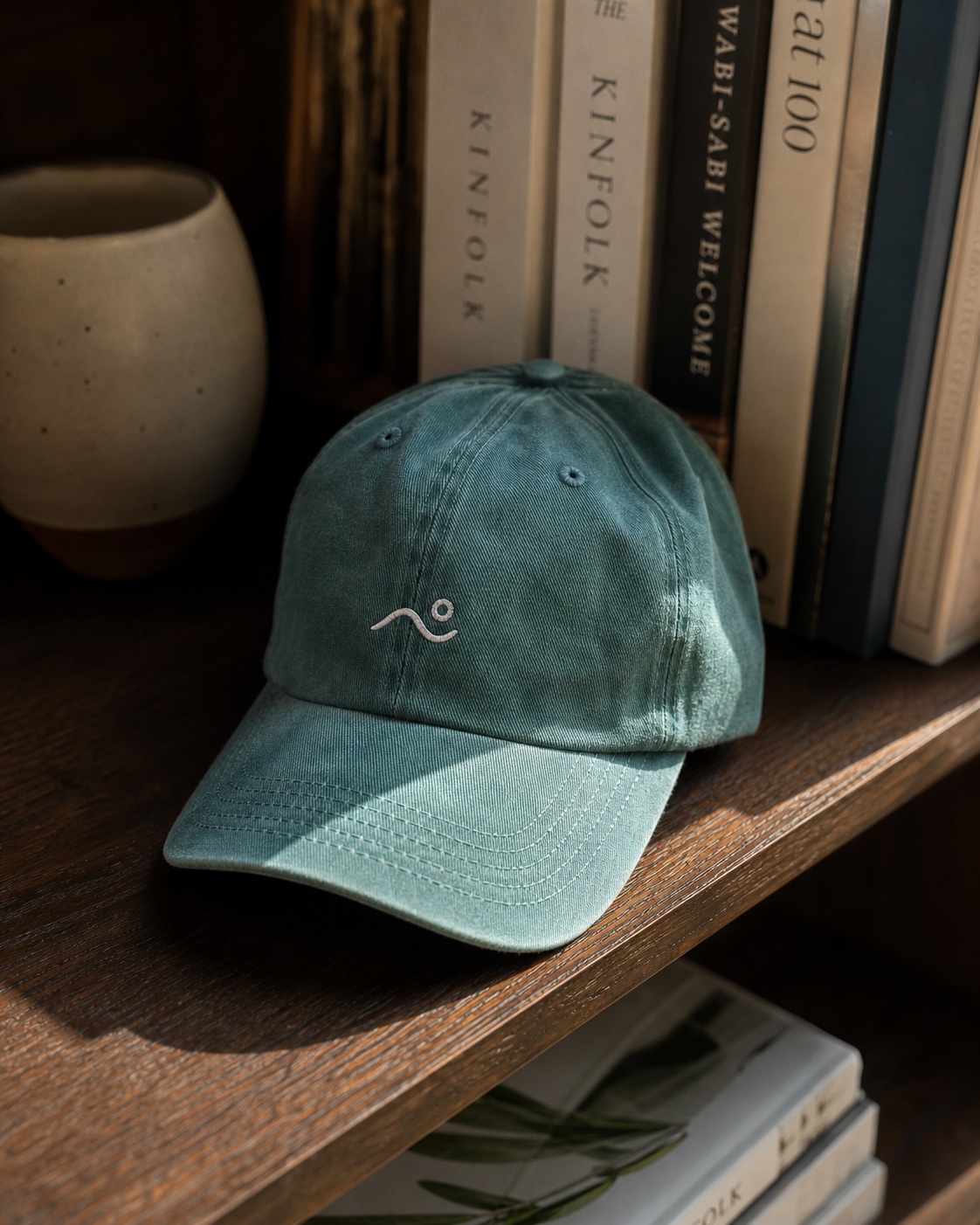 Studio cap merch photographed in a curated real-life setting